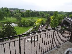 Room in Nottawasaga Inn Resort and Conference Centre, near Alliston Ontario.  View of golf course, conference patio and Nottawasaga River from balcony.